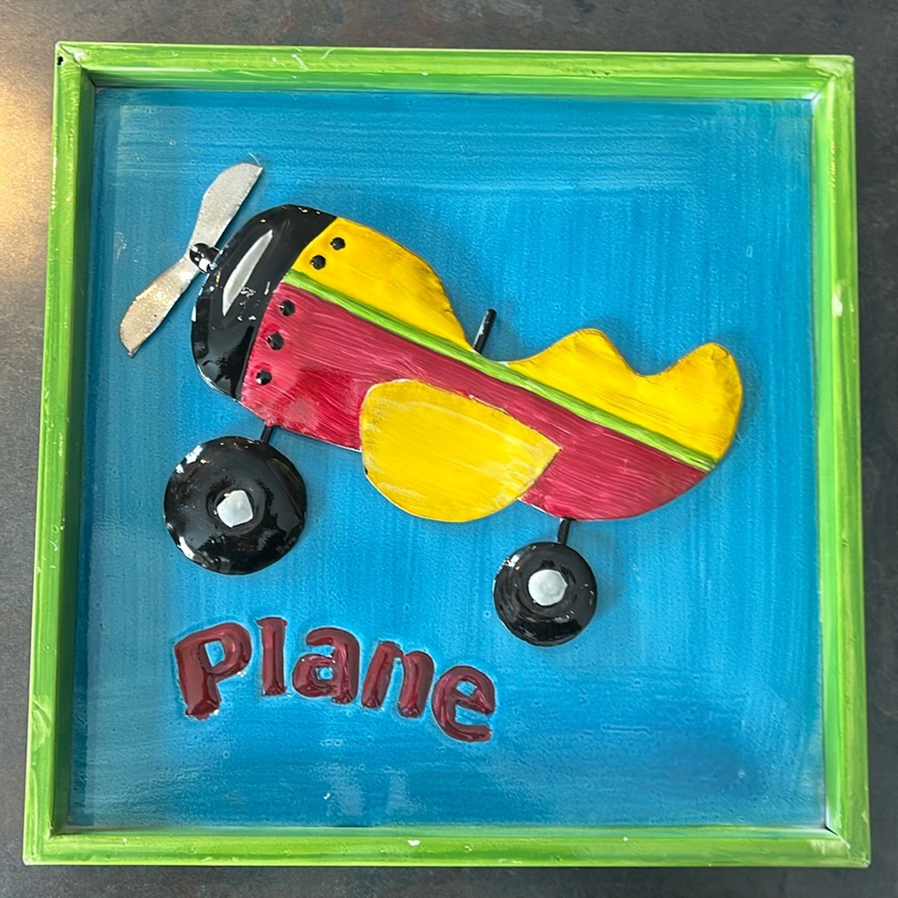 Playful tin art “plane”.  Ideal for a child’s room or your office.